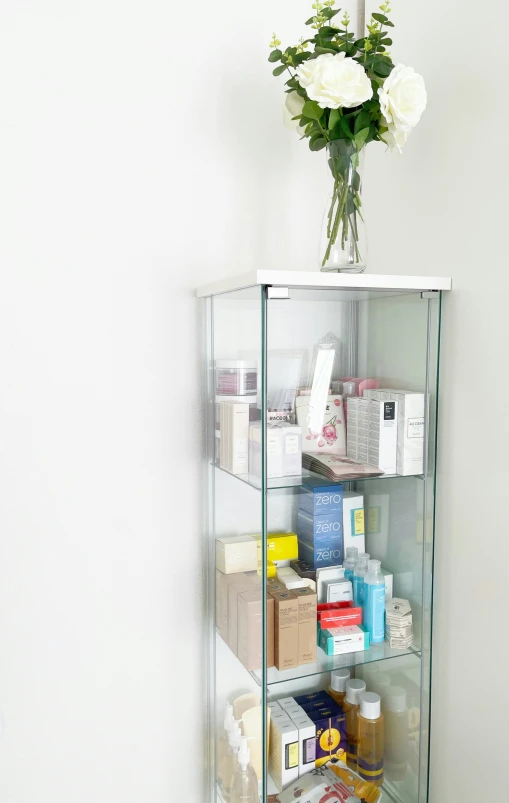 flowers and body care items are displayed on a shelf