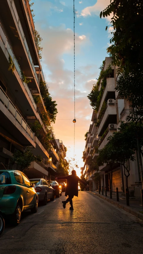 a person rides down an alley in the sun