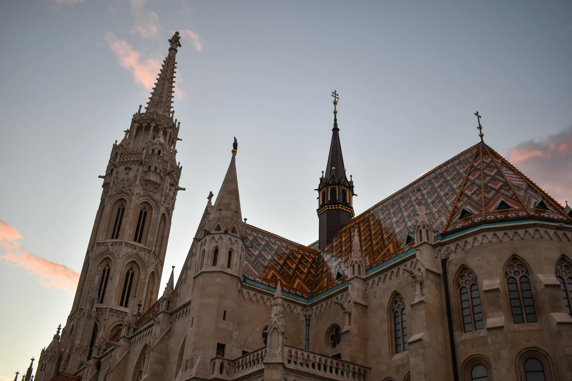 a large cathedral in an older town that has spires