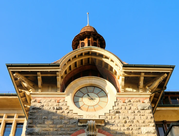 a large building has a big clock at the top