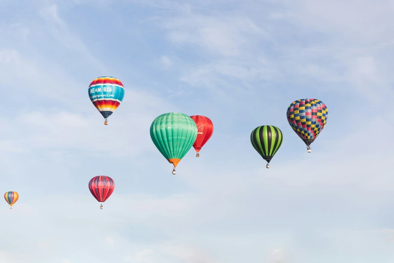 a number of  air balloons flying in the sky