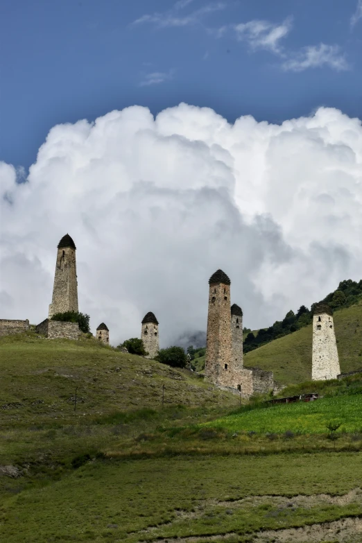 the three old towers are made from stone