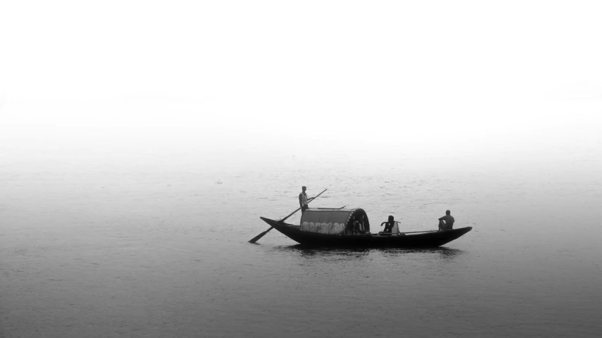 a group of people riding on the back of a small boat