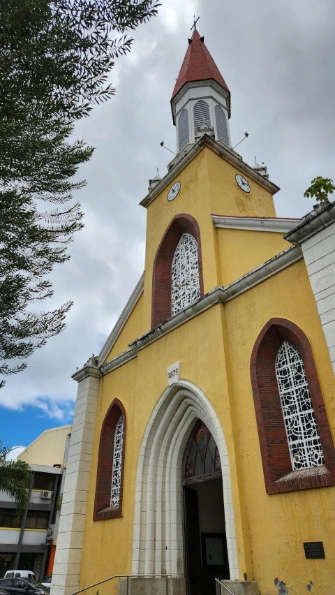 an old church on a cloudy day with stairs