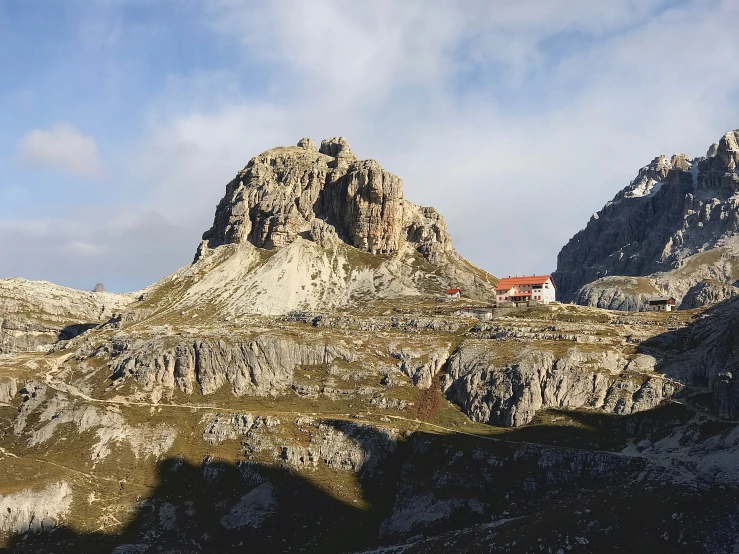 mountain landscape with small house nestled on top