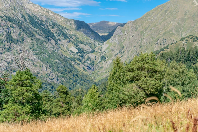 there are two people on a trail in the mountains