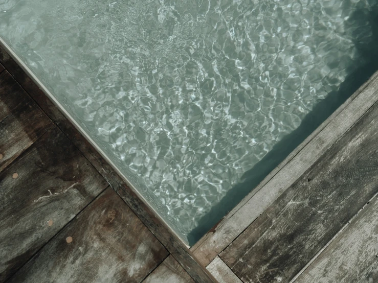 the surface of a calm water lake, with an open end ramp