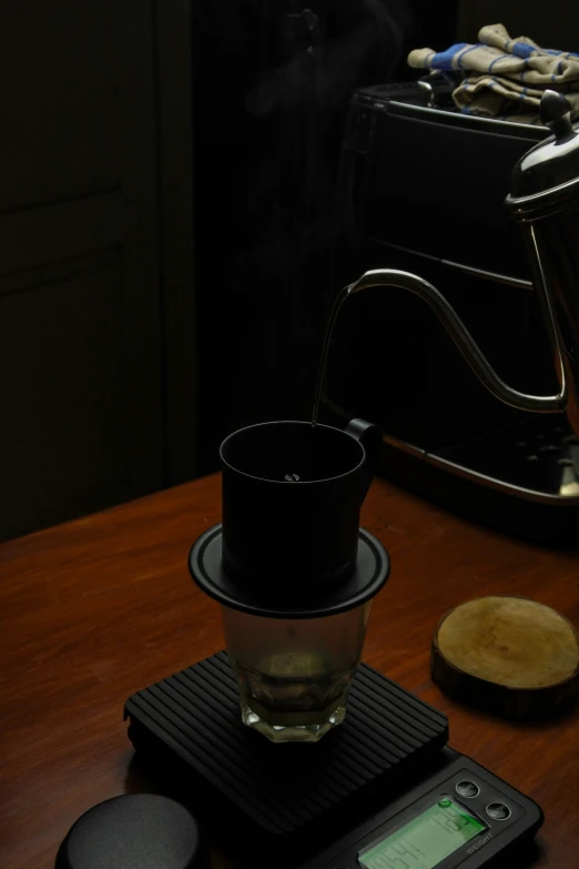 a glass sitting on top of a wooden counter top