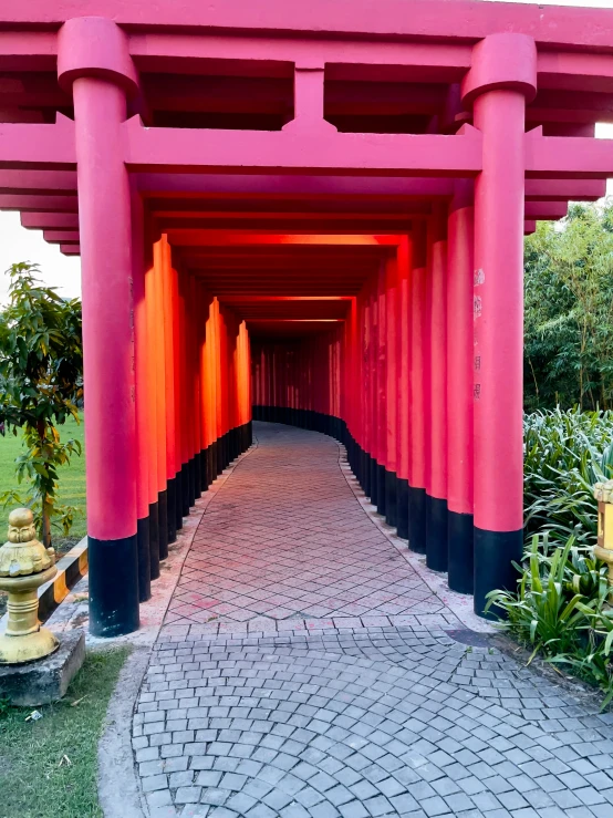 a path is lined with columns and pillars