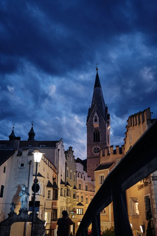 a castle is shown during dusk with clouds