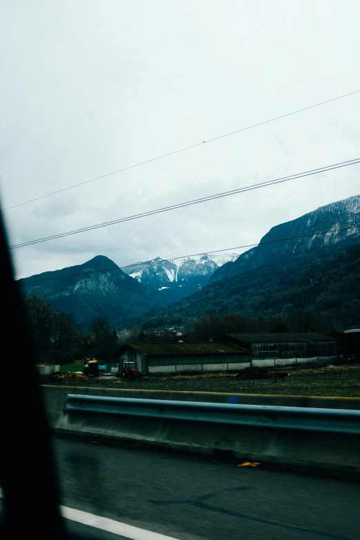 view from the side of a bus of mountains