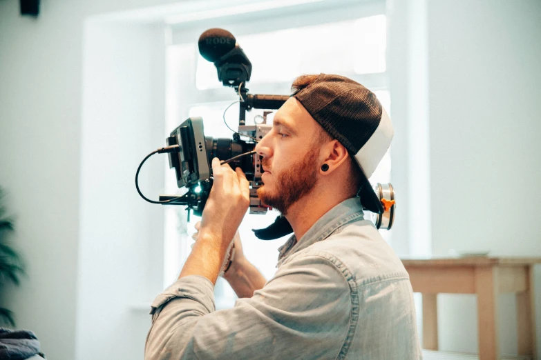 a man wearing a headscarf looking at a camera