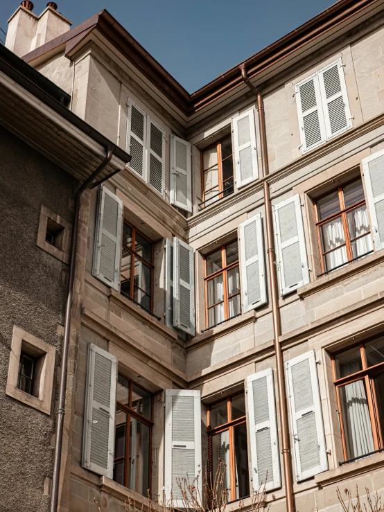 the architecture is simple with many windows and some balconies