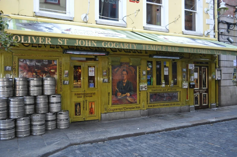 the front door to an italian restaurant that sells barrels