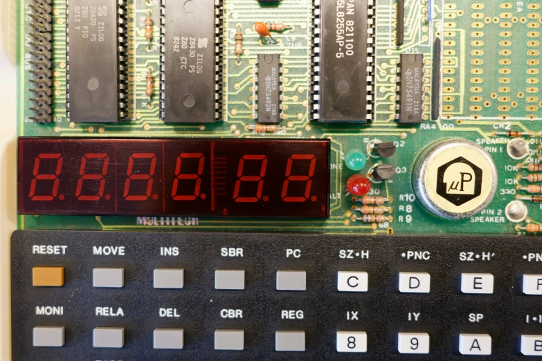 a close up of a digital clock on top of a printed circuit board