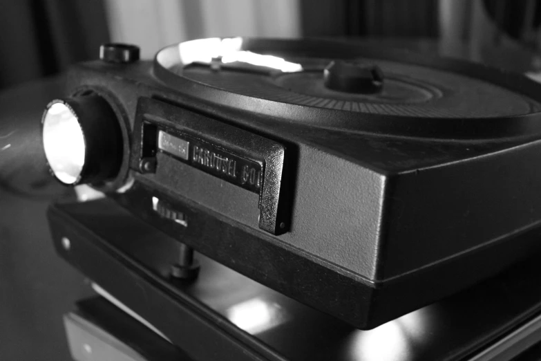 a record player and other equipment sits on the floor