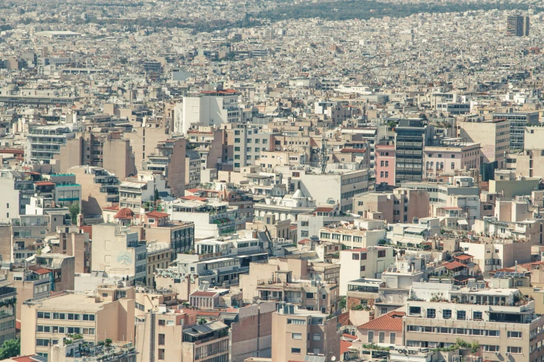 a small city sits beneath a very tall city