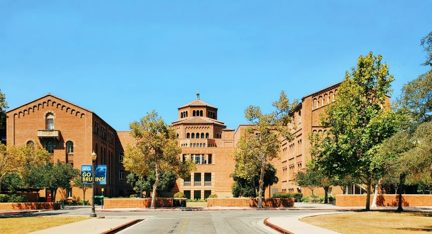 an empty street in front of an old brick church