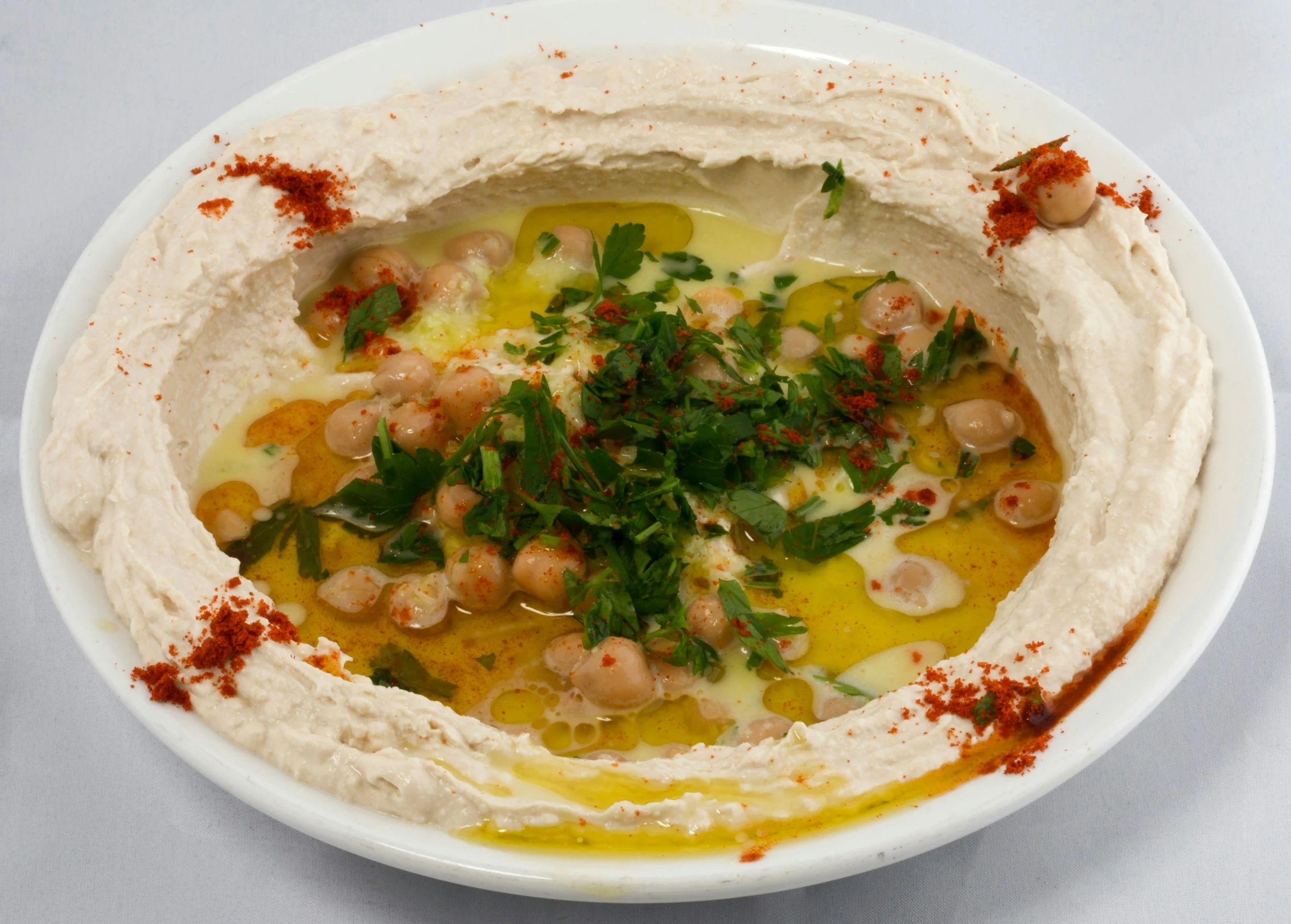 an image of a plate of hummus and other ingredients