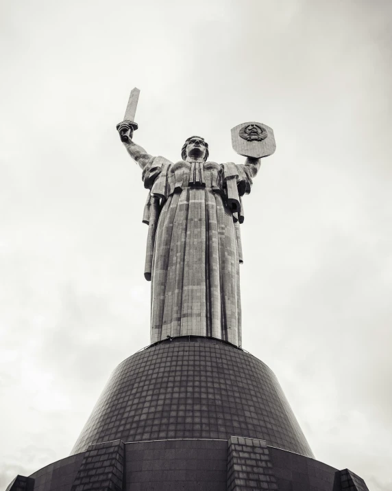 the statue of liberty atop a building in black and white