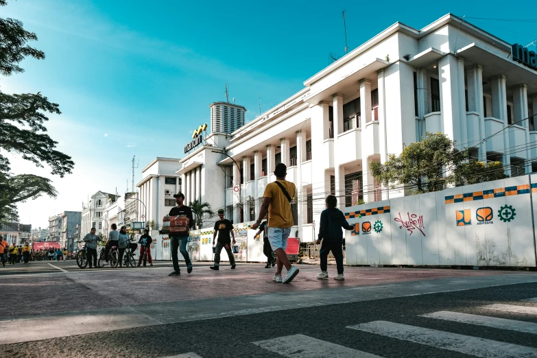 people are walking along a city street