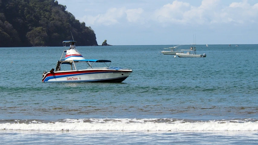 small boats out on the water on a sunny day