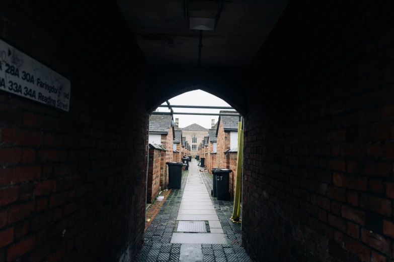 a walkway is shown through a brick tunnel