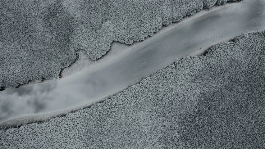 a stream flowing into a pool on a beach