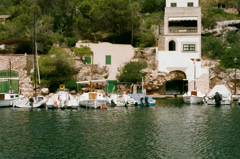 a number of sail boats in a body of water