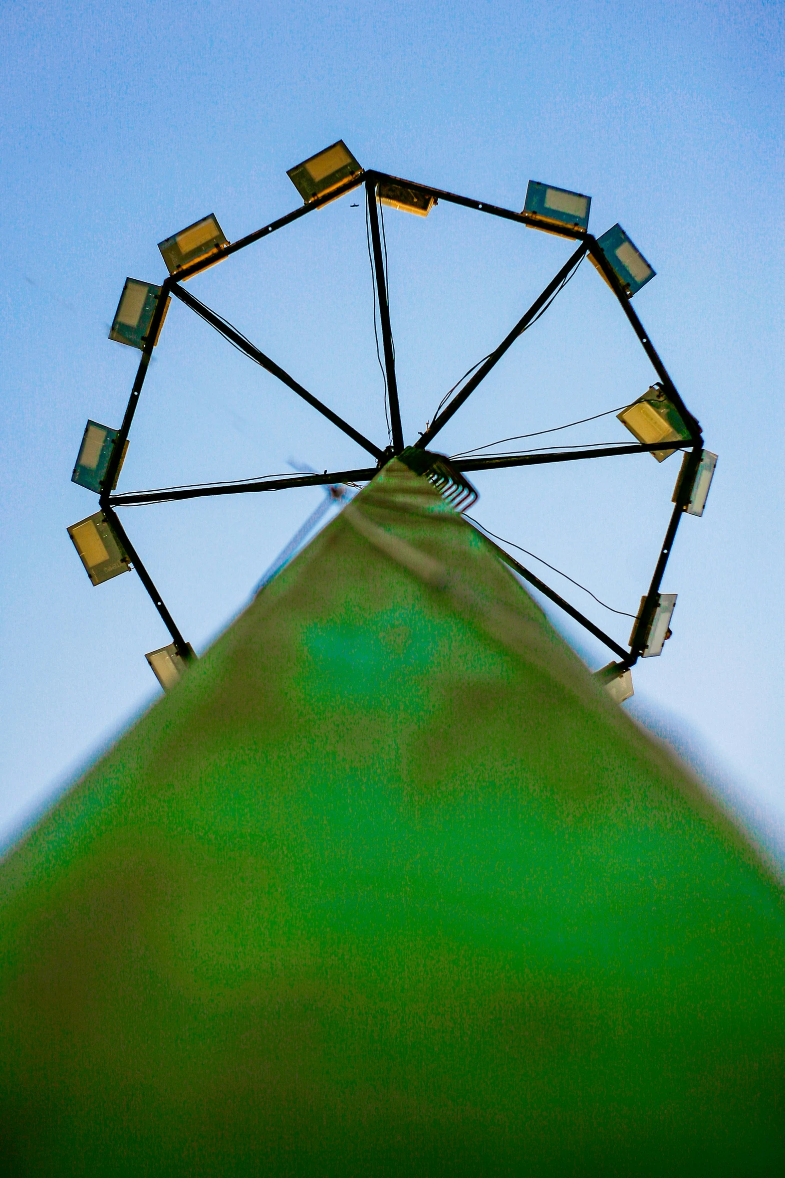 a ferris wheel with flags hanging off the sides