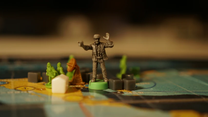 there is a small figurine on a board game