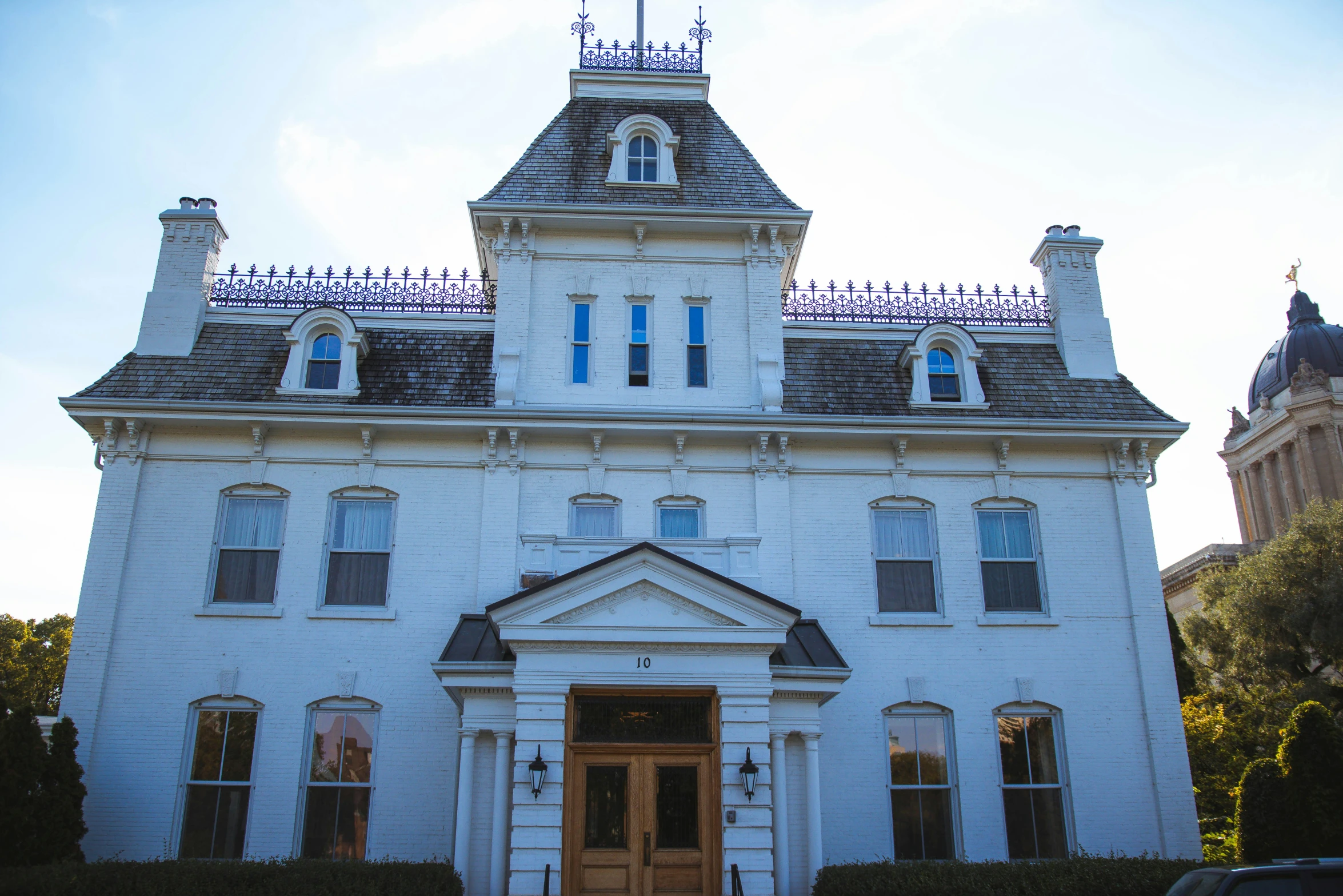 an old victorian mansion with ornate roof tiles