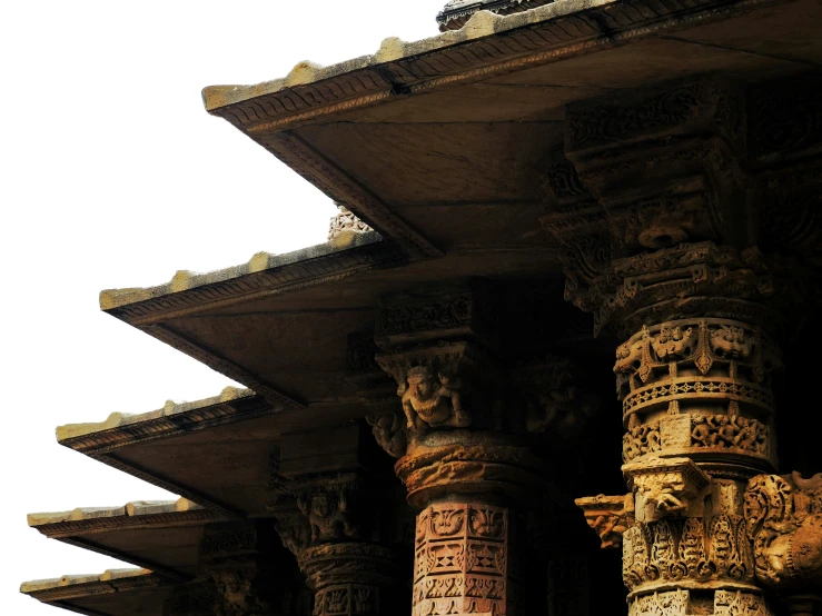 many old stone pillars lined with sculptures