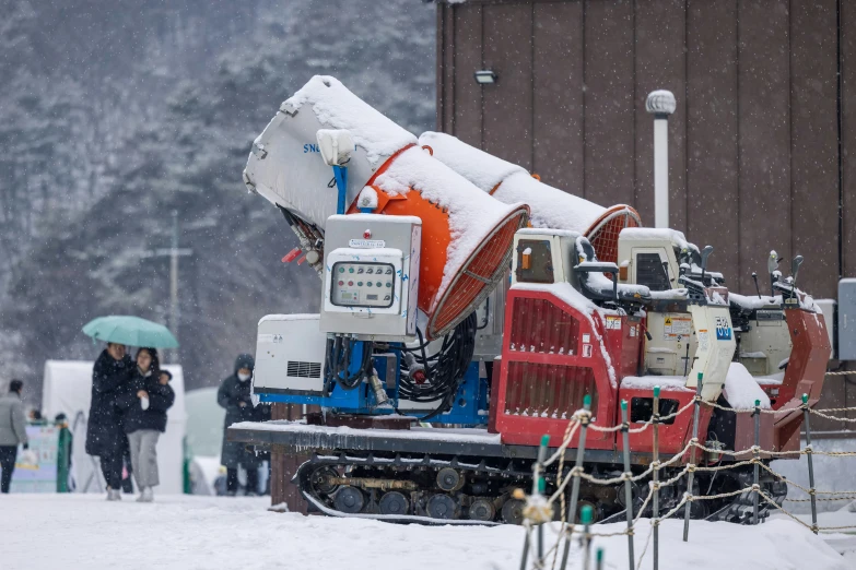 the snow is falling down on a tractor trailer