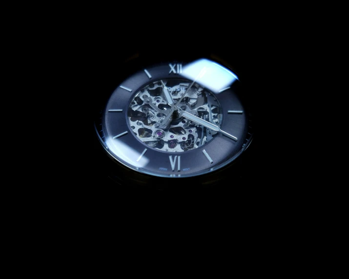 clock mechanism in the dark making it look like someones hands