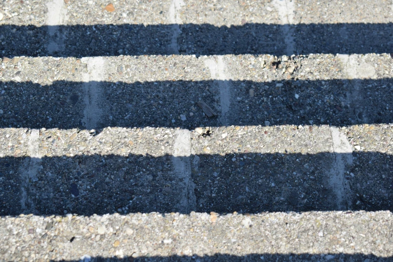 this is a pograph of the side of a road with blue lines