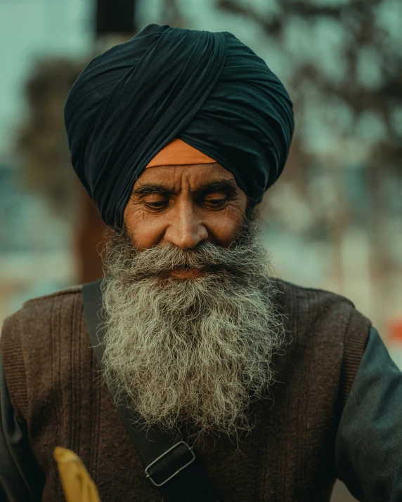 a man with a turban and an orange and banana