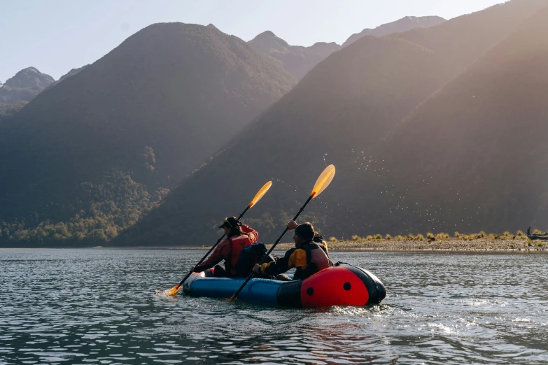 two people in canoes are rowing on the water