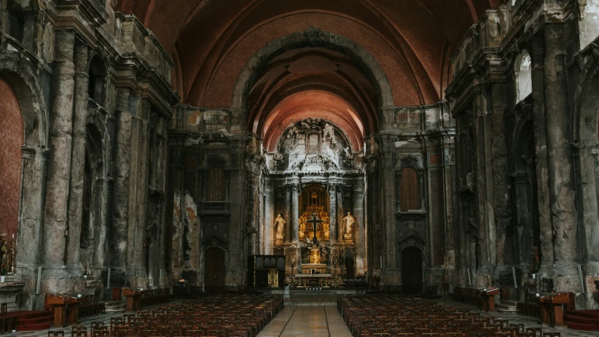 an old church with pews and stone arches