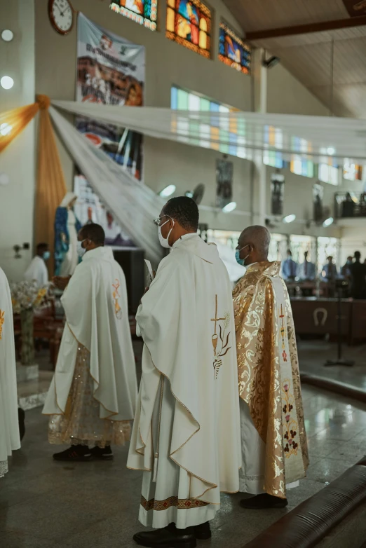 a group of priests in traditional garb at the altar