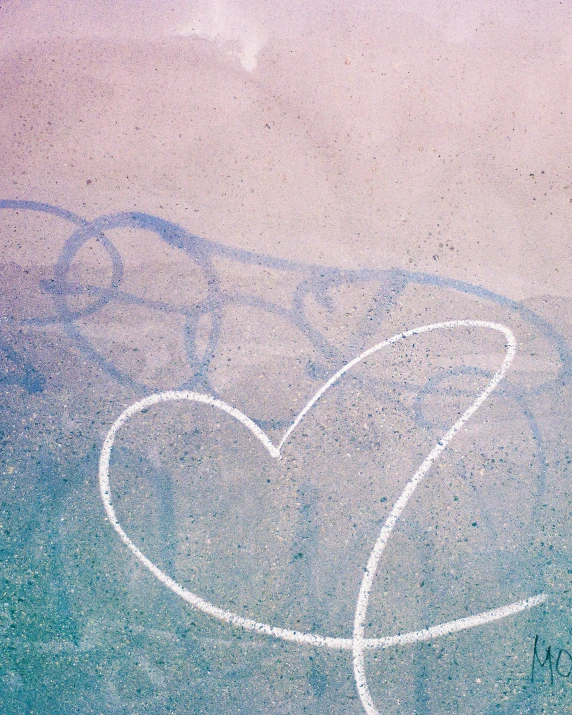 a couple of hearts in the middle of the beach