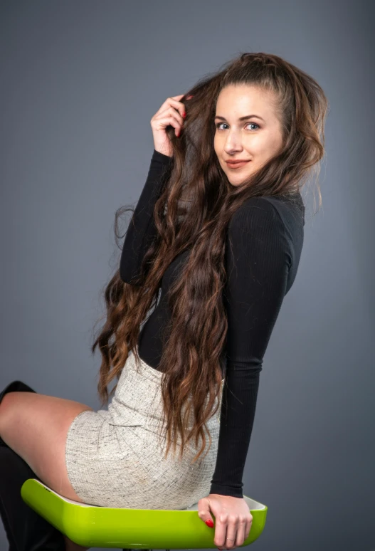 a woman posing in black and white clothing