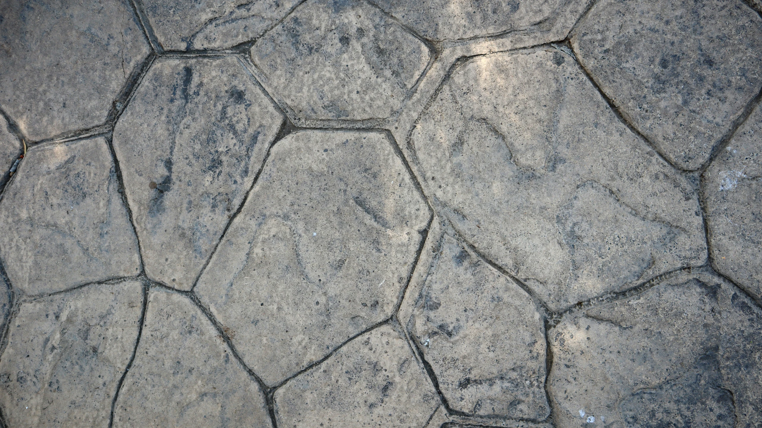 a stone sidewalk made up with small s and rocks