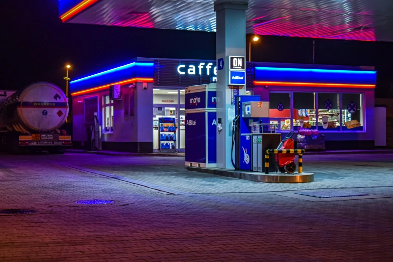 the old gas station has been painted with neon