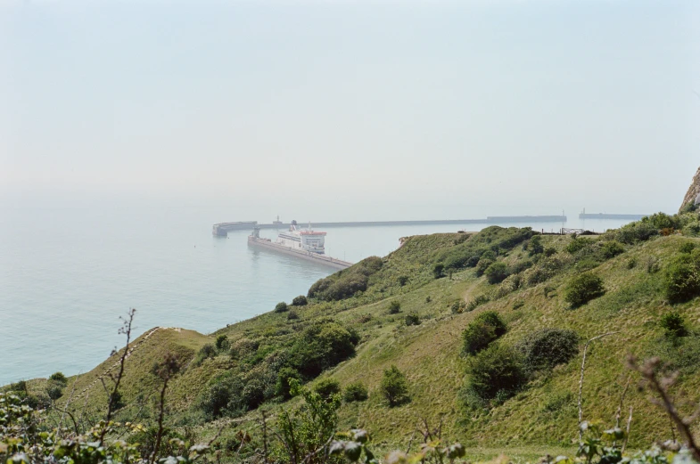 the cargo boat has passed the coast to enter the sea