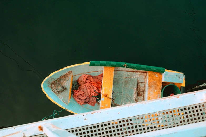 a boat that is sitting on top of a piece of metal