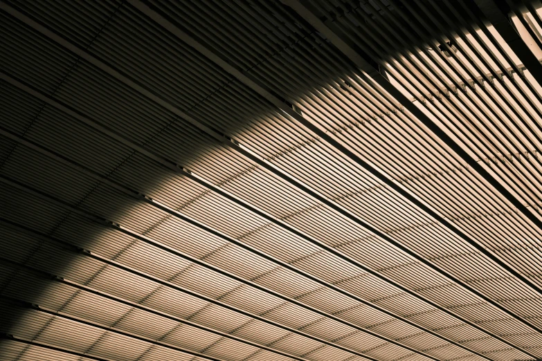 the bottom part of the ceiling in a very long room