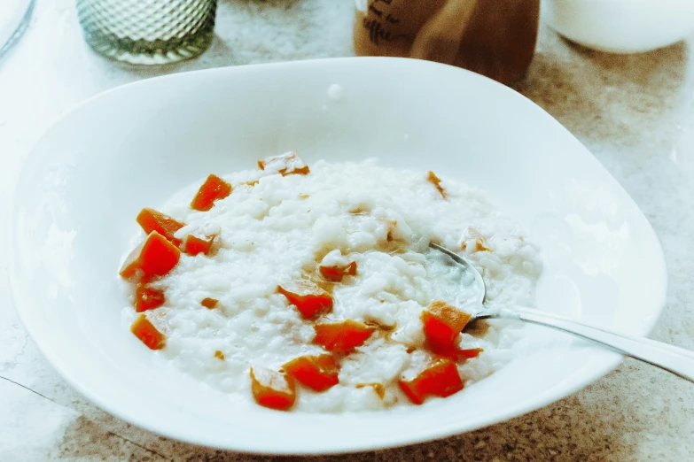 a bowl filled with rice and some kind of sauce