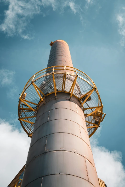 a very tall white structure with a red top