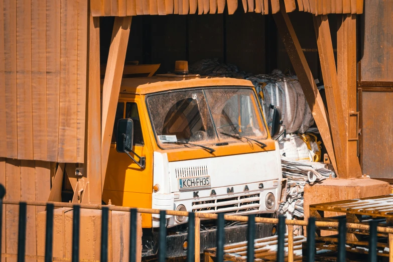 a truck has been parked in a wood structure